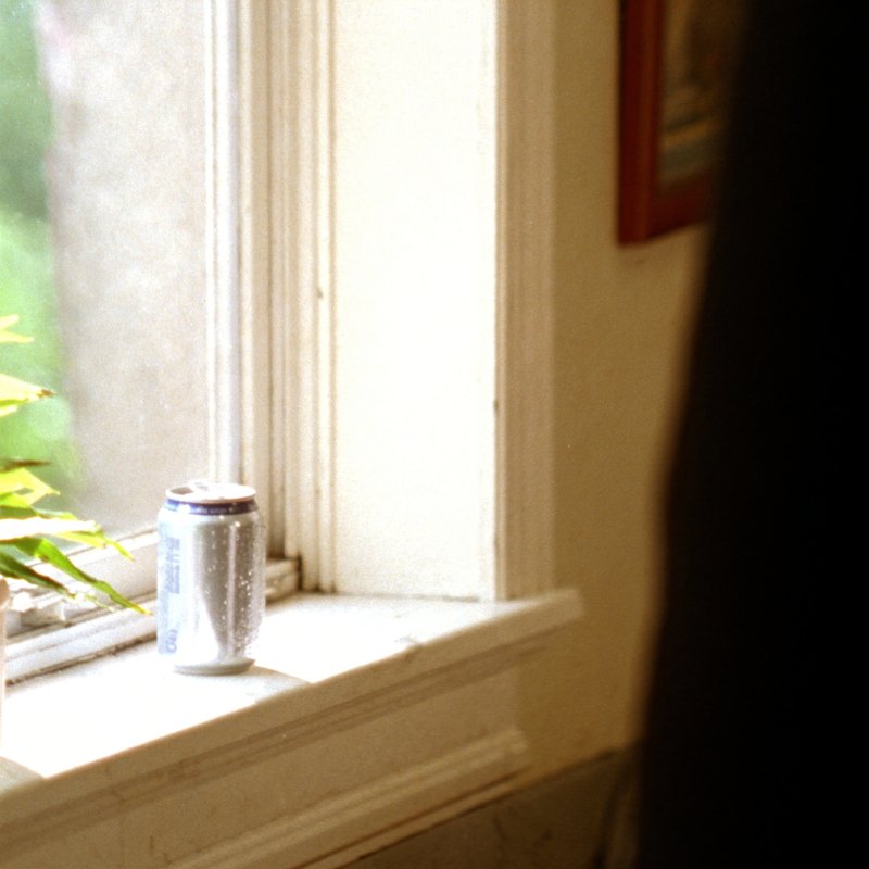 An ice-cold Diet Coke on a sunny windowsill