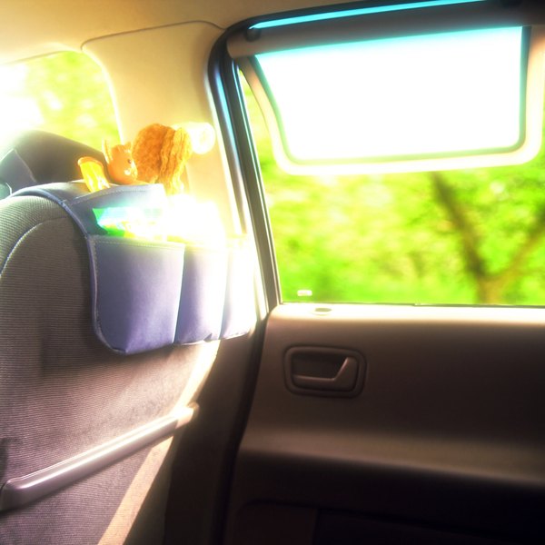 A toddler road-trip backseat organizer with snacks and toys